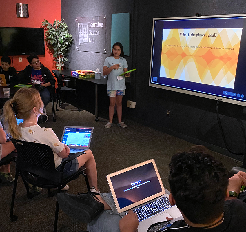 Student presenting a project in front of a room