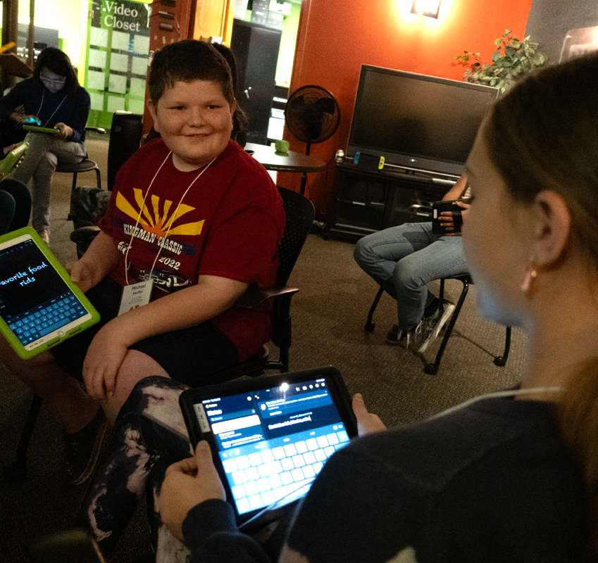 Two students discussing projects in the Learning Games Lab